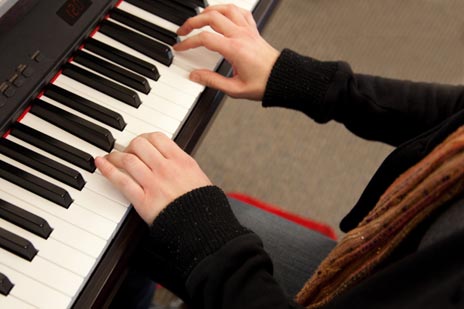 student playing the keyboard